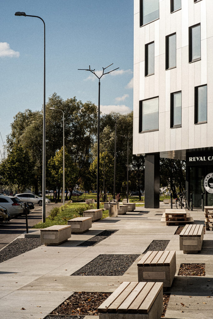 Branch public space lighting and concrete benches along the Paju plaza in daylight, Tartu