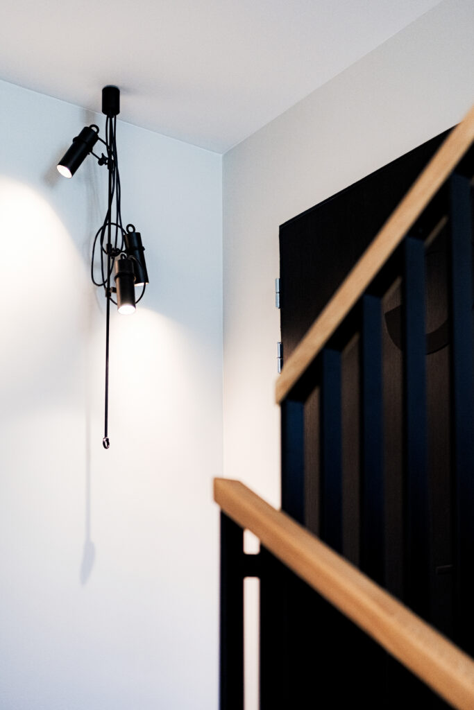 Lightweight modular pendant lighting system seen from the corridor end
