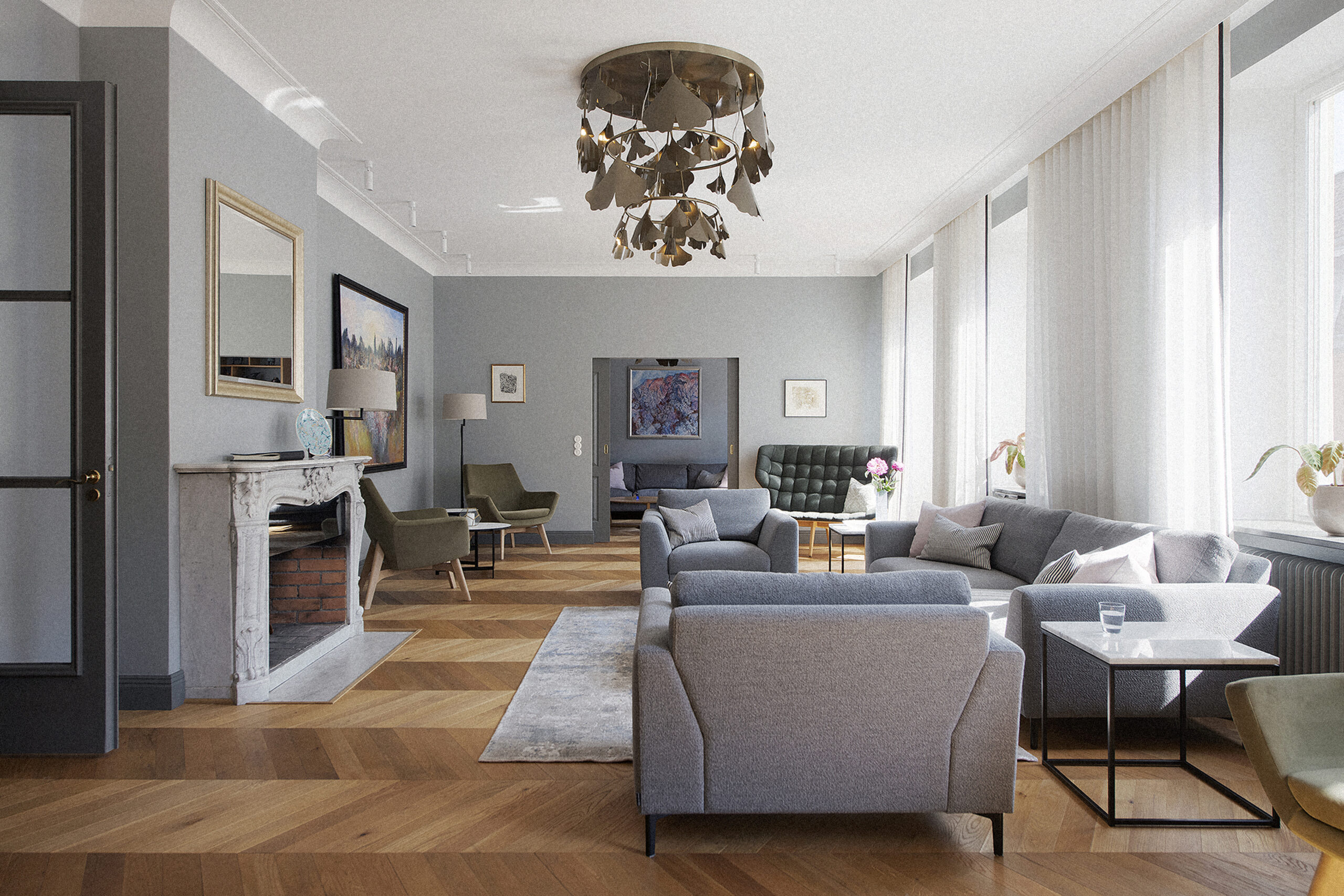 Round brass Ginko chandelier lighting a bright Stockholm living room