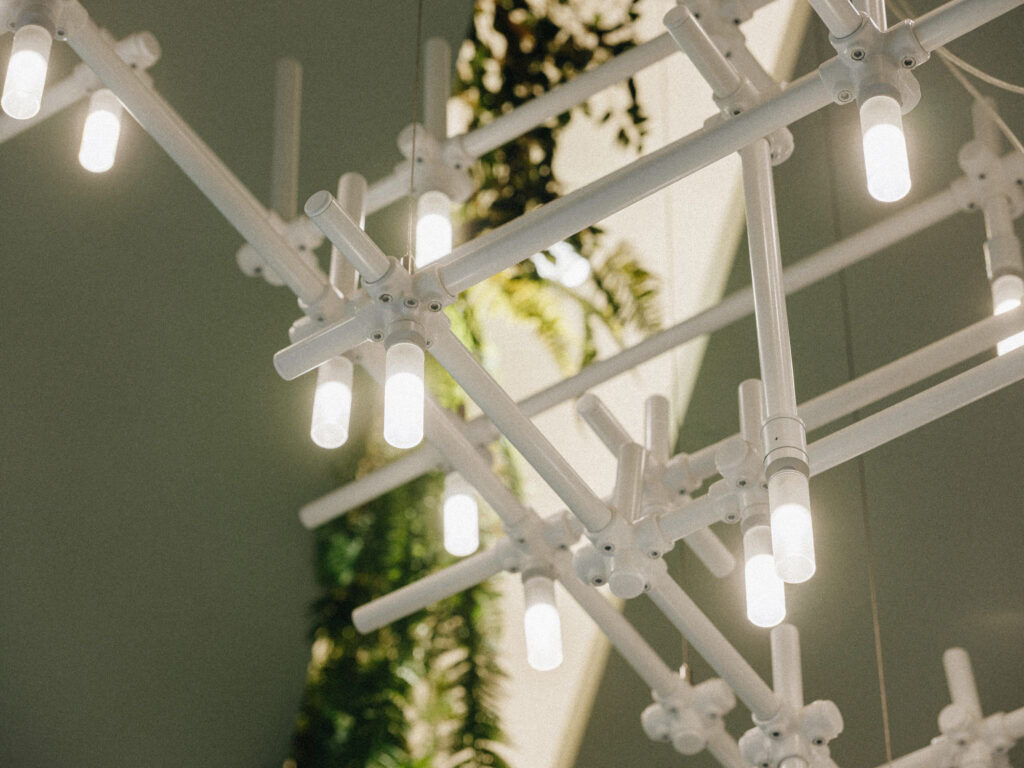 Angled detail of the white HEXA lattice and LED tubes, T1 Mall, Tallinn