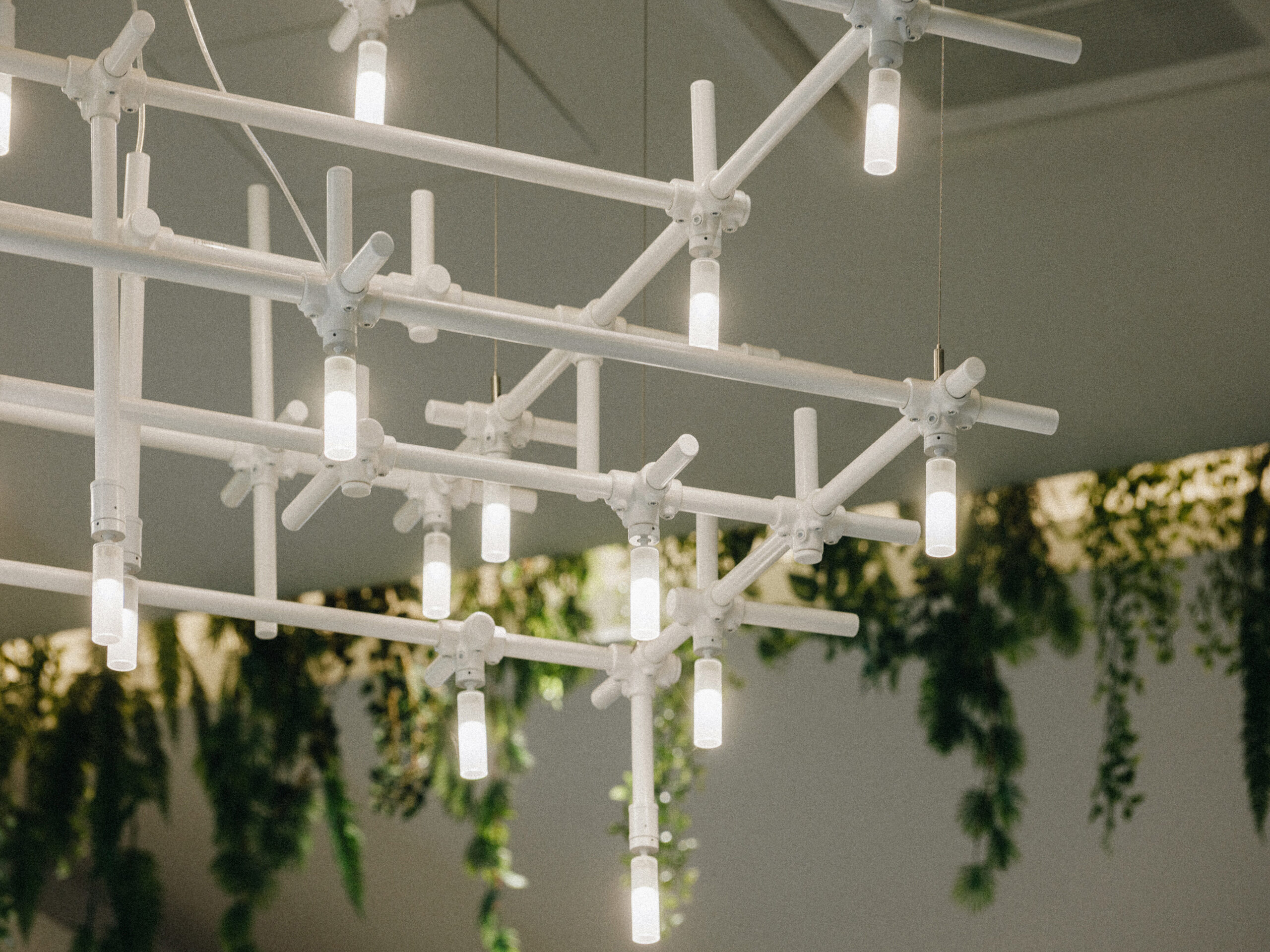 ngled detail of the white HEXA lattice and LED tubes, T1 Mall, Tallinn